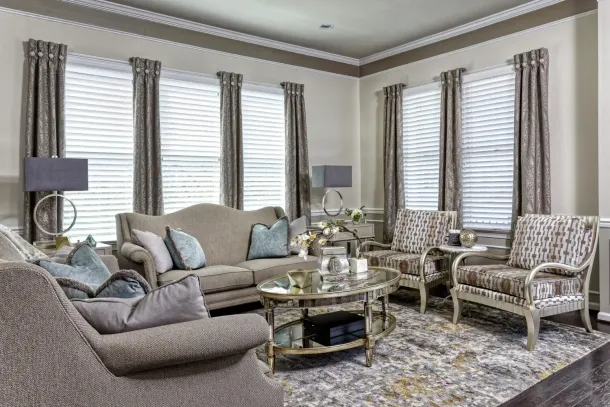 a living room with a couch and chairs
